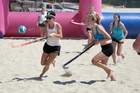 Event co-organiser Kate Savory (left) on the ball at the NZ Beach Hockey Championships held at Mount Main Beach at the weekend. Photo / Andrew Warner Event co-organiser Kate Savory (left) on the ball at the NZ Beach Hockey Championships held at Mount Main Beach at the weekend. Photo / Andrew Warner