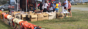 NEW FOR OLD: Old life jackets all in a row at Pukenui on Saturday, while Coastguard sells new ones in their place.