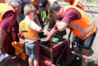 TINKERING ABOUT: Blair Jordan shows the inner workings of a track maintenance vehicle to his 4-year-old nephew, TINKERING ABOUT: Blair Jordan shows the inner workings of a track maintenance vehicle to his 4-year-old nephew,
