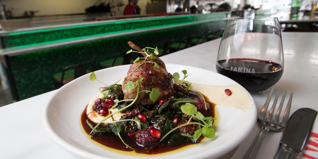 Quail stuffed with fennel and pork sausages on cauliflower puree and spicy greens at Farina restaurant. Photo / Jason Oxenham