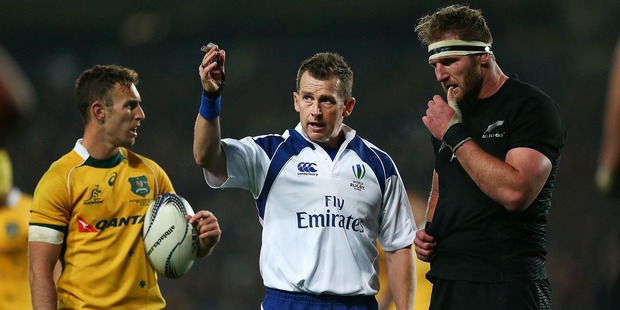 Referee Nigel Owens explains a call to Kieran Read and Nic White during the Bledisloe Cup match. Photo / Getty Images