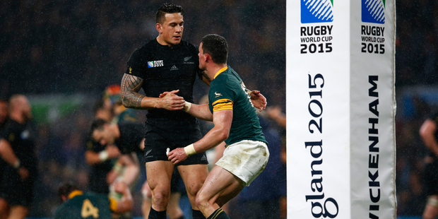 Jesse Kriel of South Africa is helped up by Sonny Bill Williams of the All Blacks. Photo / Getty Images