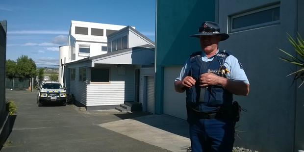 A police guard outside a property on The Esplanade, Westshore. Photo / Hawke's Bay Today