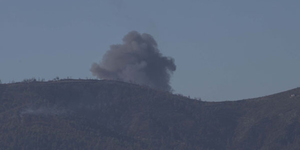 Smoke rises after the crash. Photo / Getty Images