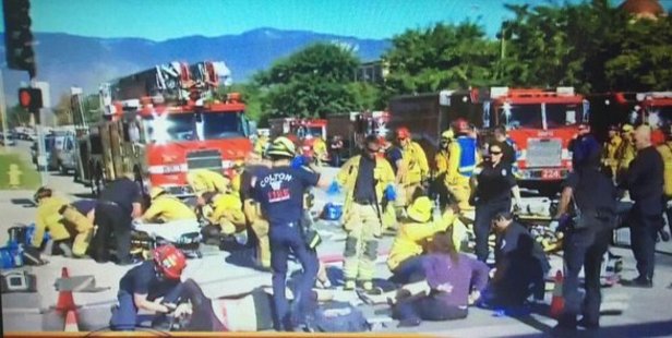 Emergency services treat victims on the tarmac as police issued alerts to find as many as three shooters. 