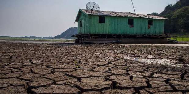 Cracked soil sits on the bed of the Aleixo Lake in the Amazonas, Brazil, on October 23, 2015 as the region suffers a severe drought. Photo / AFP