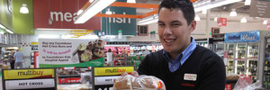 Hastings Countdown checkout 2IC Chad Thompson shows off the hot cross buns on sale in store two months before Easter. PHOTO / DUNCAN BROWN