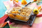 A peach crisp pudding is just one of many delicious ways to use up homegrown peaches. A peach crisp pudding is just one of many delicious ways to use up homegrown peaches.