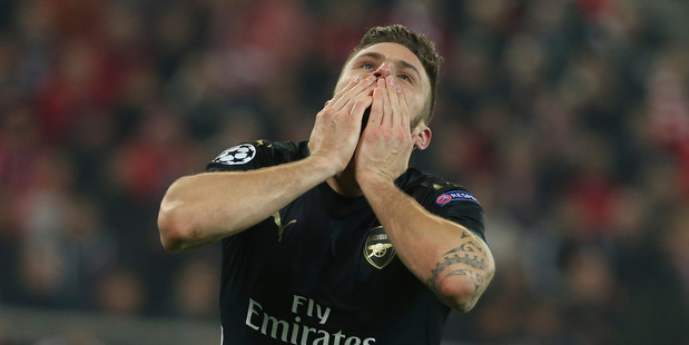 Arsenal's Olivier Giroud celebrates after scoring during a Champions League Group F soccer match between Olympiakos and Arsenal. Photo / AP.