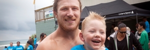 James Reid with Nathan Harris who swam in the Chiefs relay from Motiti Island to Maketu.Photo / Andrew Warner