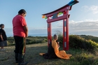 CEREMONY: Rawene woman Wong Liu Shueng of the Chinese Ventnor Group and Te Rarawa kaumatua Peter Martin watch as Buddhist monk Venerable Zhuji performs a blessing for the Chinese gold miners lost on the Ventnor. PHOTO/KING TONG HO CEREMONY: Rawene woman Wong Liu Shueng of the Chinese Ventnor Group and Te Rarawa kaumatua Peter Martin watch as Buddhist monk Venerable Zhuji performs a blessing for the Chinese gold miners lost on the Ventnor. PHOTO/KING TONG HO