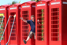 Matua couple Carolyn Wilkey and Murray Wilkey have collected 14 traditional red English telephone boxes. PHOTO/John Borren Matua couple Carolyn Wilkey and Murray Wilkey have collected 14 traditional red English telephone boxes. PHOTO/John Borren