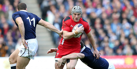 Wales' Jonathan Davies is tackled by Scotland's Mark Bennett, right, and Tim Visser, left. Photo / AP