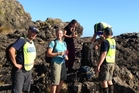 The Canadian tourists after they were rescued by members of the police Search and Rescue unit. Photo / Cliff Metcalfe The Canadian tourists after they were rescued by members of the police Search and Rescue unit. Photo / Cliff Metcalfe
