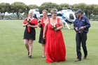 SMOOTH LANDING: Bride Caro Greenwood and bridesmaids Tara Jensen (left) and Pip Greenwood, were delivered to the aisle by helicopter, temporarily halting eight cricket games at Frimley Park, Hastings, on Saturday. SMOOTH LANDING: Bride Caro Greenwood and bridesmaids Tara Jensen (left) and Pip Greenwood, were delivered to the aisle by helicopter, temporarily halting eight cricket games at Frimley Park, Hastings, on Saturday.