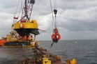 Debris being lifted out of the ocean from the Rena. PHOTO/SUPPLIED Debris being lifted out of the ocean from the Rena. PHOTO/SUPPLIED