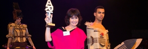 WINNING SMILE: Kate Mackenzie with her two-part design Poly Nation, which won the Supreme Award at the 2014 World of Wearable Art. PHOTO/SUPPLIED