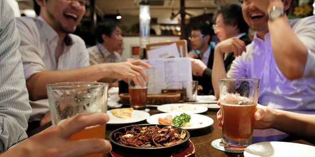 Japanese workers like to live it up over the holiday season but don't like heading to work with a hangover. Picture / Bloomberg