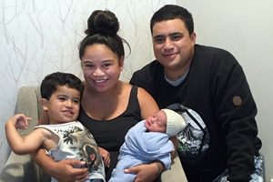 WELCOME: Te Puke's Waikamania Thompson and partner Wharera Dinsdale, with their new baby and their two-year-old son Waipihangarangi. PHOTO/ SUPPLIED