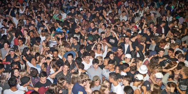 IN THE GROOVE: Thousands of revellers packed in like sardines saw in their New Year dancing on the sand in front of the iHeartRadio Beach Stage at the Mount main beach.PHOTOS/ANDREW WARNER