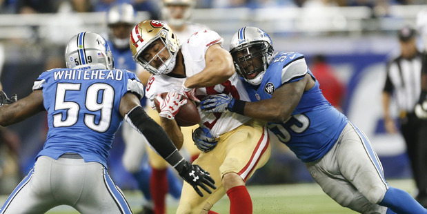 Jarryd Hayne gets hit during a clash against the Detroit Lions. Photo /Getty