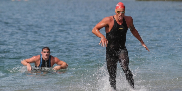 Kane Radford exits the lake first on his way to winning Sunday's Legend of the Lake at the Blue Lake, Rotorua. Photo / Simon Watts