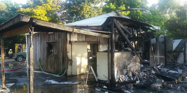 SAVED: Firefighters managed to save part of this shed, including the chiller room and ice-maker, near Kohukohu on Thursday afternoon. PICTURE/SUPPLIED
