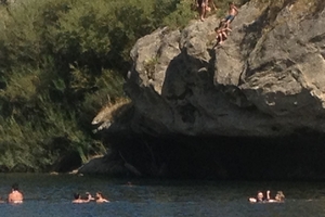 Some of the hundreds of people who have been swimming in the Manawatu River.