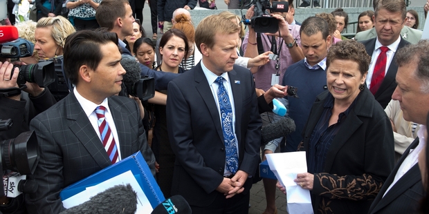 Leisa Renwick with Tauranga MP Simon Bridges and Health Minister Jonathan Coleman after delivering the 11,000-strong petition, calling for Pharmac to fund melanoma drugs, at Parliament. Photo / Mark Mitchell