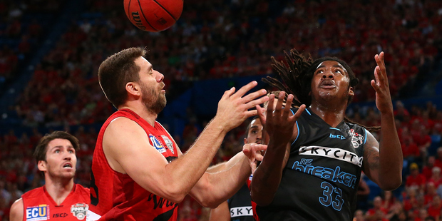 Tom Jervis and Charles Jackson contest a rebound during game one of the Grand Final series. Photo / Getty Images