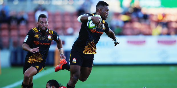 Seta Tamanivalu slips a tackle during the Chiefs' encounter with the Lions in Hamilton. Photo / Getty