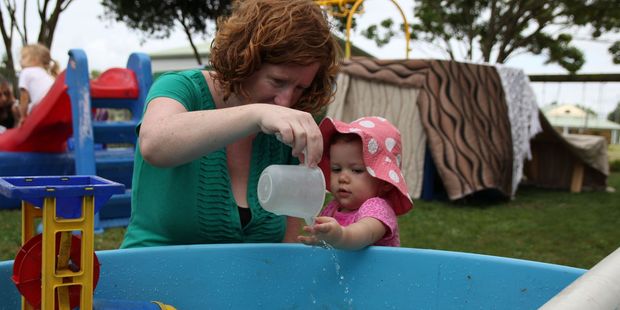 Leah Nakaora and her daughter, Ruth, explore water play at River Downs Playcentre.