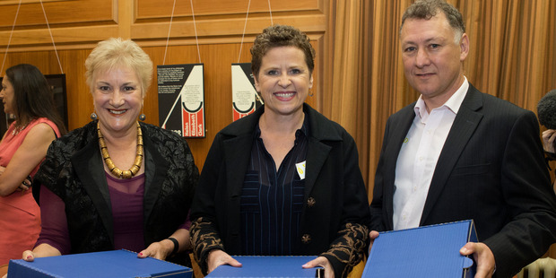 Leisa and Wayne Renwick with Labour health spokesperson Annette King and the 11,000 strong petition. Photo / Mark Mitchell