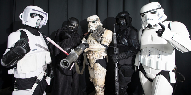 Stormtroopers and Darth Vader pose for a photo. Photo / Nick Reed