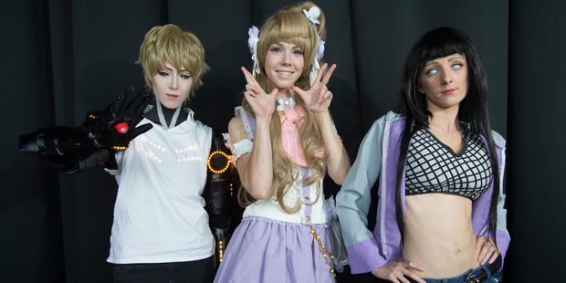 L-R Vadim Scanlon as Genos, Kelly Smith as White Day Kotori and Elisha Ward as Hinata Hyuga pose for a photo. Photo / Nick Reed