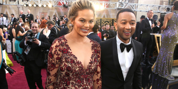 Model Chrissy Teigen with John Legend, didn't realise she would get so much backlash for admitting she chose to have a baby girl during IVF. Photo / AP