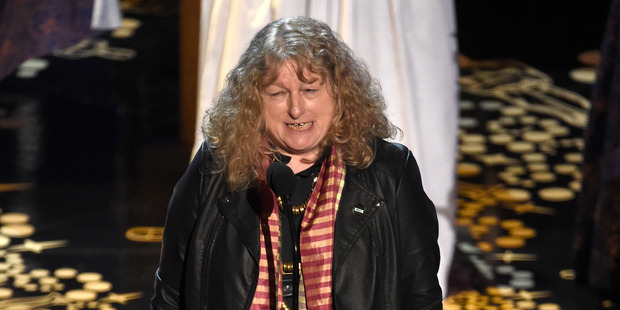 Dressed down in a leather jacket Jenny Beavan accepts the award for best costume design for Mad Max: Fury Road. Photo / AP