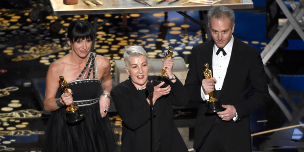 Elka Wardega, from left, Lesley Vanderwalt, and Damian Martin accept the award for best makeup and hairstyling for Mad Max: Fury Road. Photo / AP