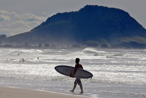 A surfer at Papamoa Beach. Photo/file