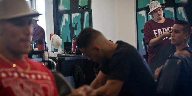 'CHILLIN': Clients take time out at Faded Barber Shop. Photo/Andrew Warner