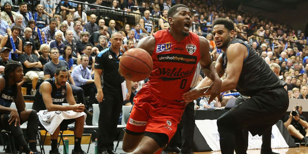 Jermaine Beal drives past Corey Webster. Photo / Getty