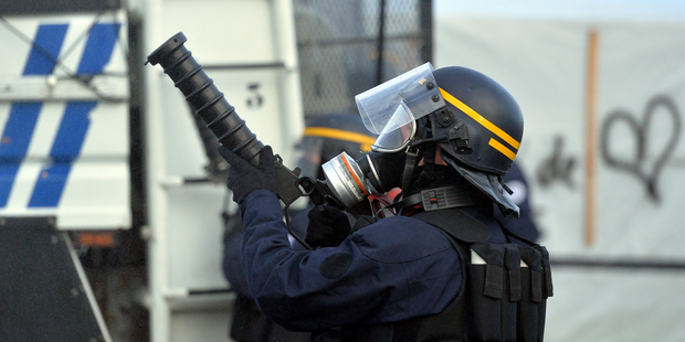 Anti-riot policemen take part in the clearing of the refugee camp in Calais. Photo / Getty Images