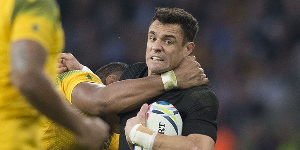 Dan Carter is tackled during the Rugby World Cup final. Photo / Brett Phibbs