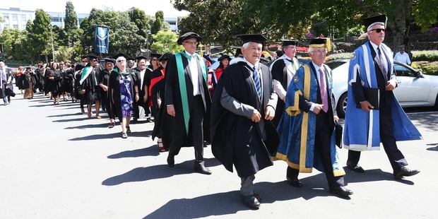 The graduates from University of Auckland's Tai Tokerau campus march through Whangarei to Forum North where they officially graduated on Friday. Photo / Michael Cunningham