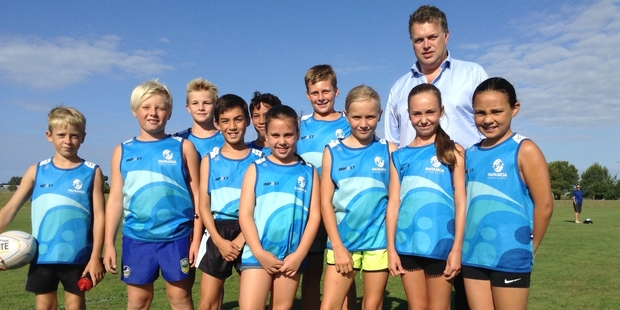 Papamoa Primary Year 5/6 Blue with their coach, Jeremy Cunningham.