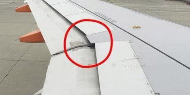 The packed passenger jet had already taxied to the runway when the 25-year-old Swiss man saw the tool wedged between the flaps which are raised or lowered. Photo / Twitter / @airlivenet