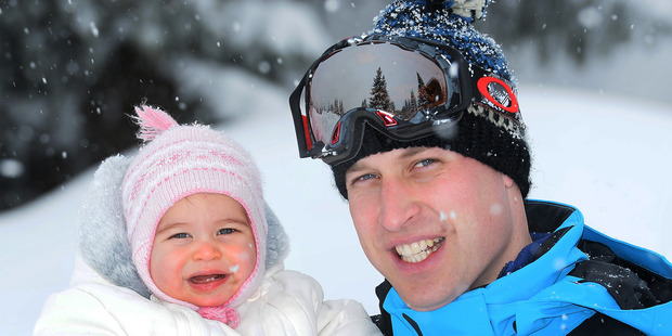 Britain's Prince William poses with Princess Charlotte as they enjoy a short private break skiing in the French Alps. Photo / AP