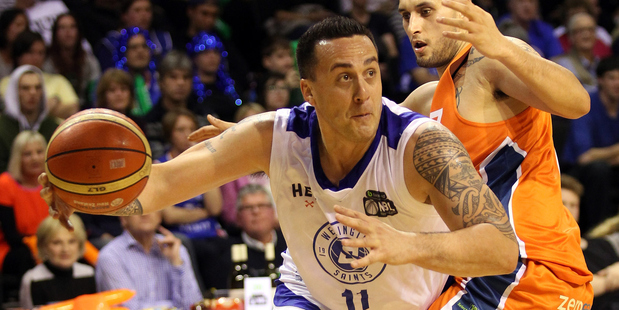 Brendon Polyblank drives to the hoop despite the defence of Duane Bailey. Photo / Getty Images