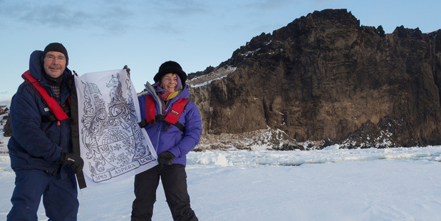 James Hood Ross and Philppa Jane Ross (great-great grandson and great-great-great granddaughter of Sir James Clark Ross) with their family flag on an expedition to Antarctica. Image / supplied