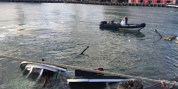 The Kestrel floating in Wynyard Wharf after sinking this morning. Photo / Supplied via Tom Warren
